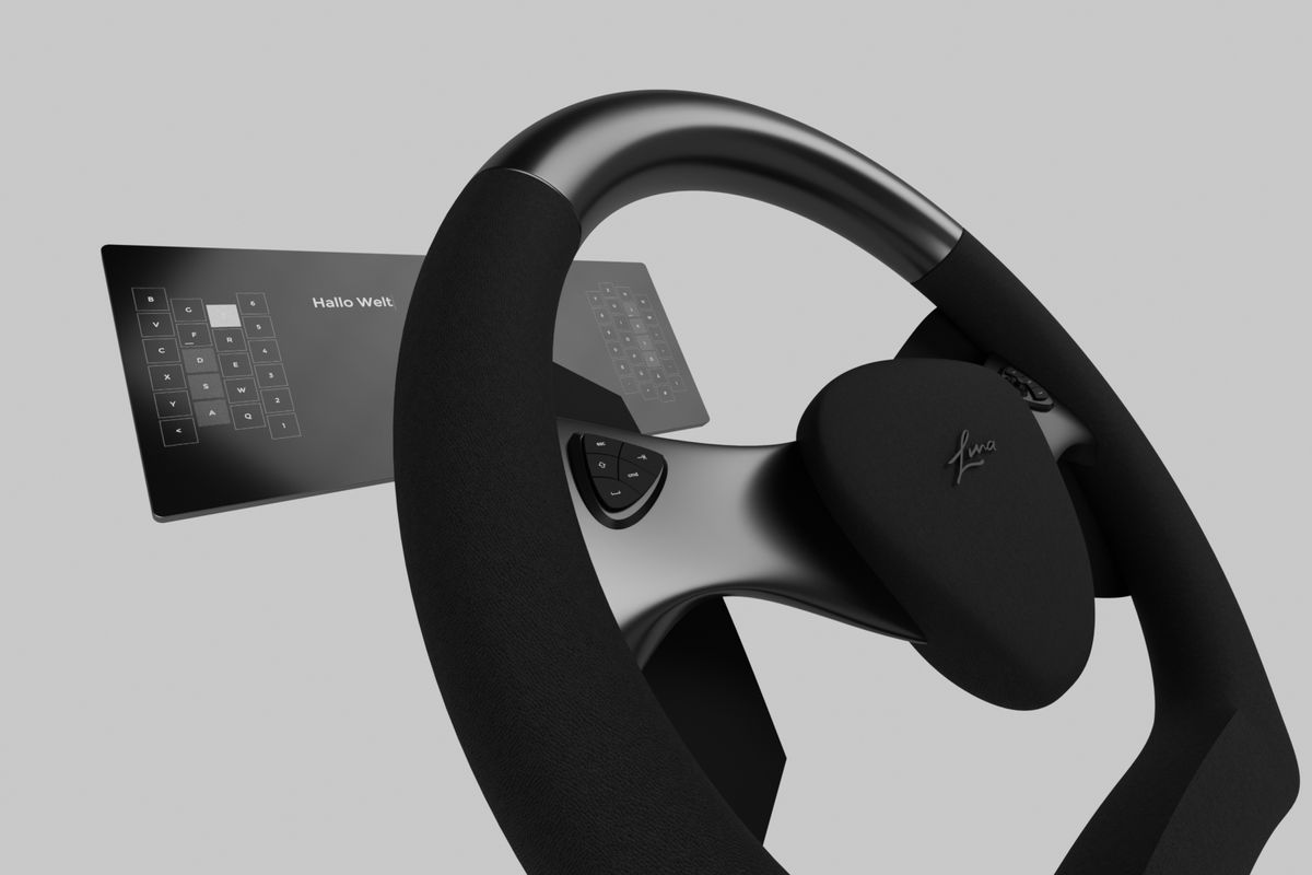 The steering wheel being used for work while driving. 